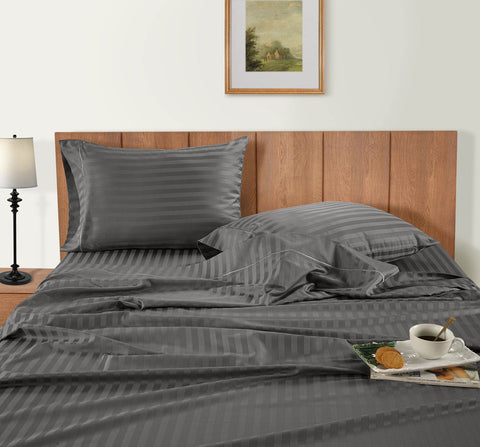 Charcoal Colour Bedsheet on the wooden bed with breakfast  
