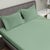 Iceberg Green Colour Bedsheet With 2 Pillows under a Charcoal Colour Bed, 400 TC Bedsheet, Orangic Bedsheet