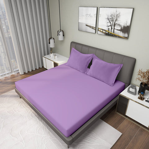 Mulberry Colour Bedsheet With 2 Pillows on Charcoal Coloured Bed with two photo frames