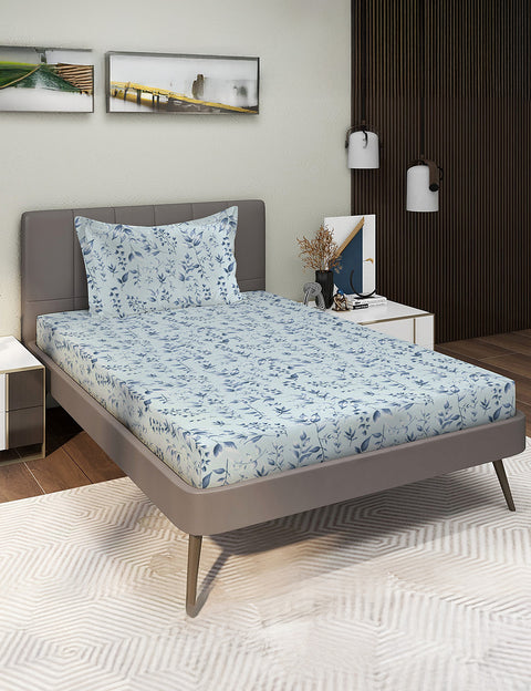 Bed with floral bedding in a bedroom setting