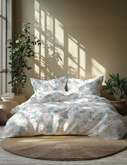 Floral bedding set on a bed with sunlight filtering through the window