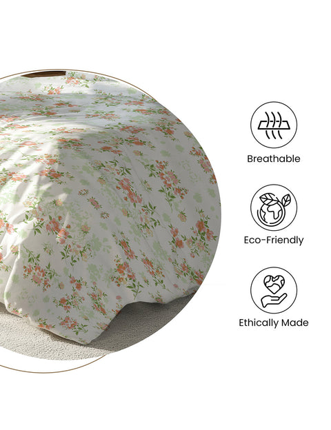Floral-patterned fitted sheet on a bed with 'Breathable', 'Eco-Friendly', and 'Ethically Made' 