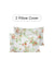 Two floral pillow covers on a white background