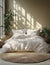 Floral bedding set on a bed with plants and sunlight in the background