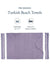 Turkish beach towel with text indicating pre-washed, oversized size, and pack of two on a white background.