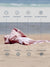 Pink towel on sand with text highlighting features like quick dry, sand proof, breathable, machine washable, absorbent, compact, versatile, and stylish design.