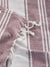 Close-up of a pink and white striped fabric with 'Lane Linen' branding.