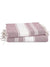 Stack of pink and white striped towels with tassels on a white background
