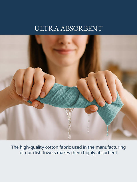 Person holding a blue dish towel with water dripping, emphasizing absorbency describes the high quality cotton fabric used in the manufacturing of our dish towels makes them highly absorbent