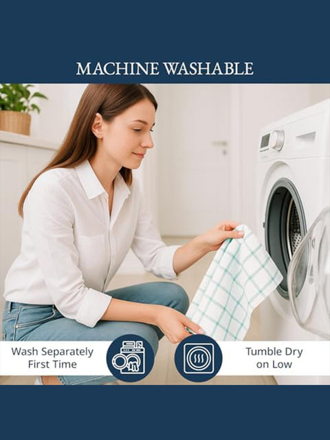 Woman with a towel next to a washing machine, indicating machine washable product 
