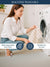 Woman washing a White & Beige Striped towel with text on machine washability and care instructions.