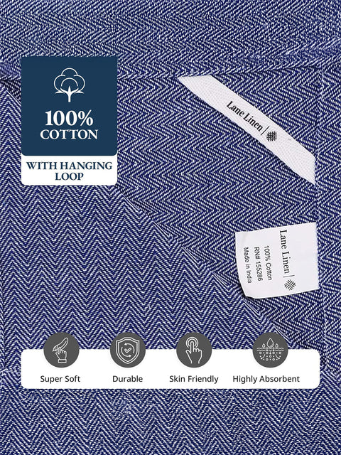 Indigo Color Kitchen Towel with '100% Cotton' label, hanging loop, and product details on a blue and white patterned background i.e Super Soft, Durable, Skin Friendly, Highly Absorbent