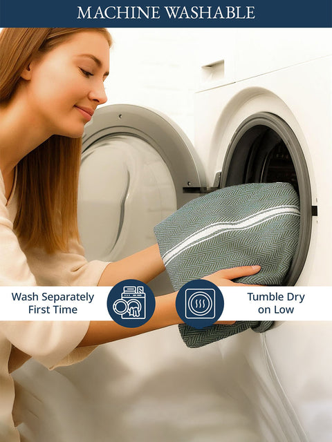 A Woman placing a Olive Color Towel into a washing machine with washing instructions displayed.