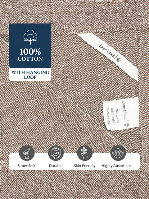 Labels that indicates 100% cotton  hanging loop, and features like super soft, durable, skin friendly, and highly absorent on a beige color kitchen towel