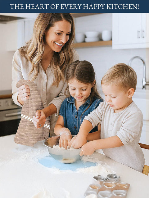 A Woman holding Biege Color Kitchen Towel and two children in a kitchen mixing ingredients together. The Picture Indicates The heart of Every Happy Kitchen Through The Kitchen Towels