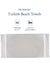 Turkish beach towel packaging with text and a sample towel on a white background