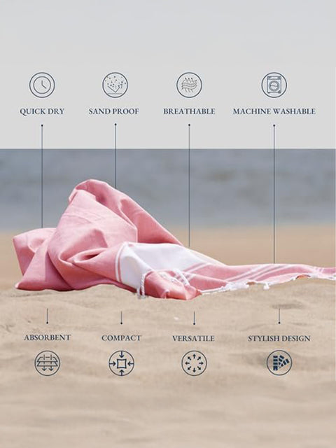 Candy Pink towel on sand with text highlighting features like quick dry, sand proof, breathable, machine washable, absorbent, compact, versatile, and stylish design.