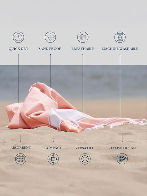 Quartz Pink towel on sand with text highlighting features like quick dry, sand proof, breathable, machine washable, absorbent, compact, versatile, and stylish design.