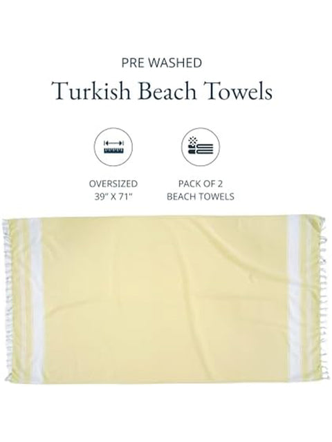 Yellow Turkish beach towel with white stripes on a white background, labeled as pre-washed and oversized.