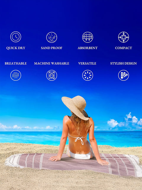 Woman sitting on a beach with a towel, surrounded by icons and text highlighting towel features like quick dry, sand proof, absorbent, compact, breatheable, machine washable, versatile, stylish design 