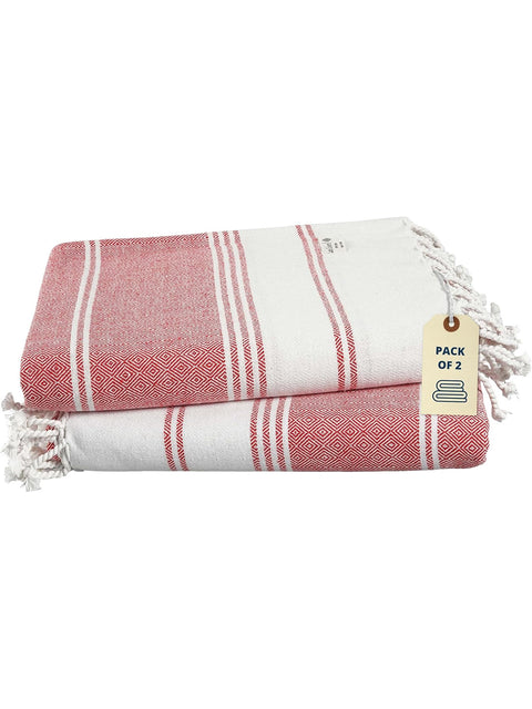 Pack of two red and white patterned towels with a tag on a white background