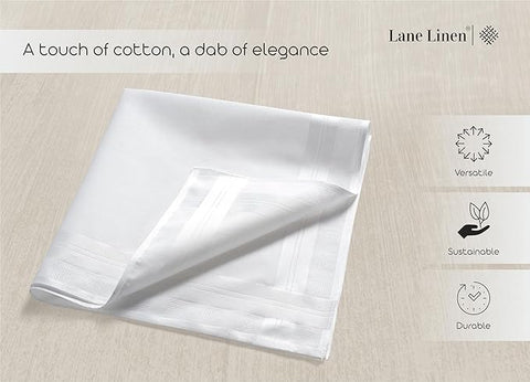 White folded linen napkin on a light wooden surface with 'Lane Linen' branding and sustainability icons.