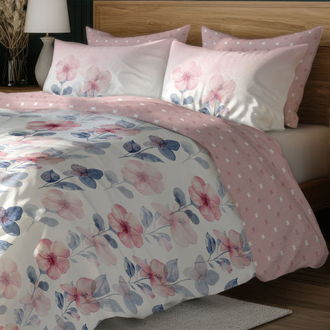 Pink & Blue Floral Colour Bedsheet With 4 Pillows On a Wooden Bed