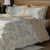 Blue & Brown Colour Floral Bedsheet Pattern With 4 Pillows On A Wooden Bed