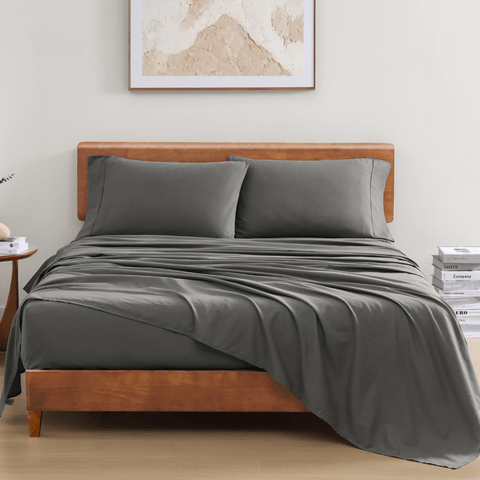 Charcoal Colour Bedsheet with 2 Pillows On a Wooden Bed