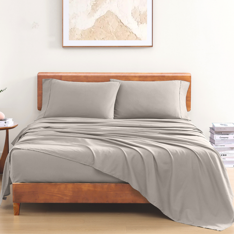 Single Bedsheet with Silver Color on a Wooden Bed with 2 Pillows with Photoframe in background