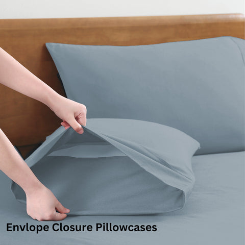 Double sized Bedsheet with 2 pillowss of french blue color on a wooden bed