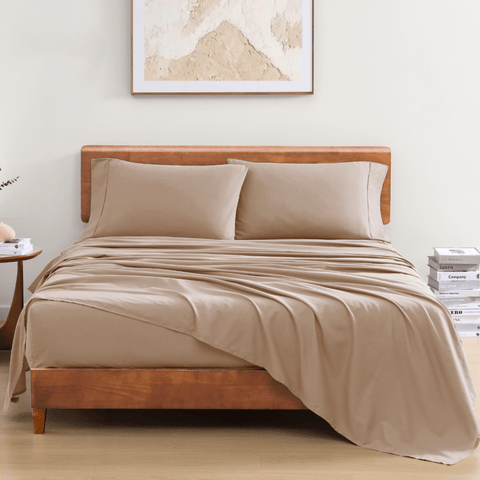 Double size Bedsheet With 2 Pillows on a wooden bed with photo frame in the background