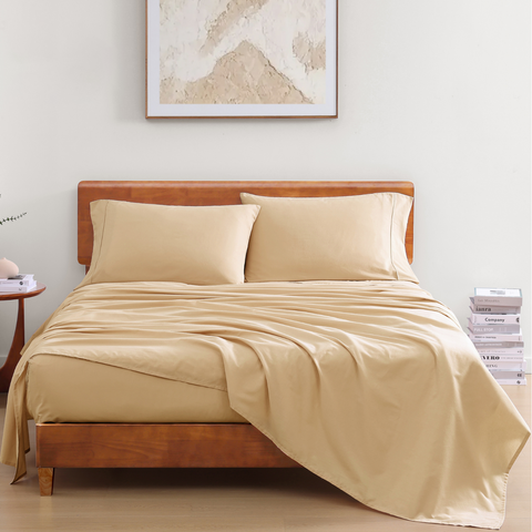 King Sized Bedsheet With 2 Pillows of A Linen Color On A Wooden Bed