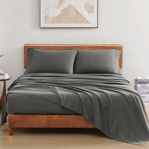 King Sized Bedsheet, 2 Pillows On A Wooden Bed